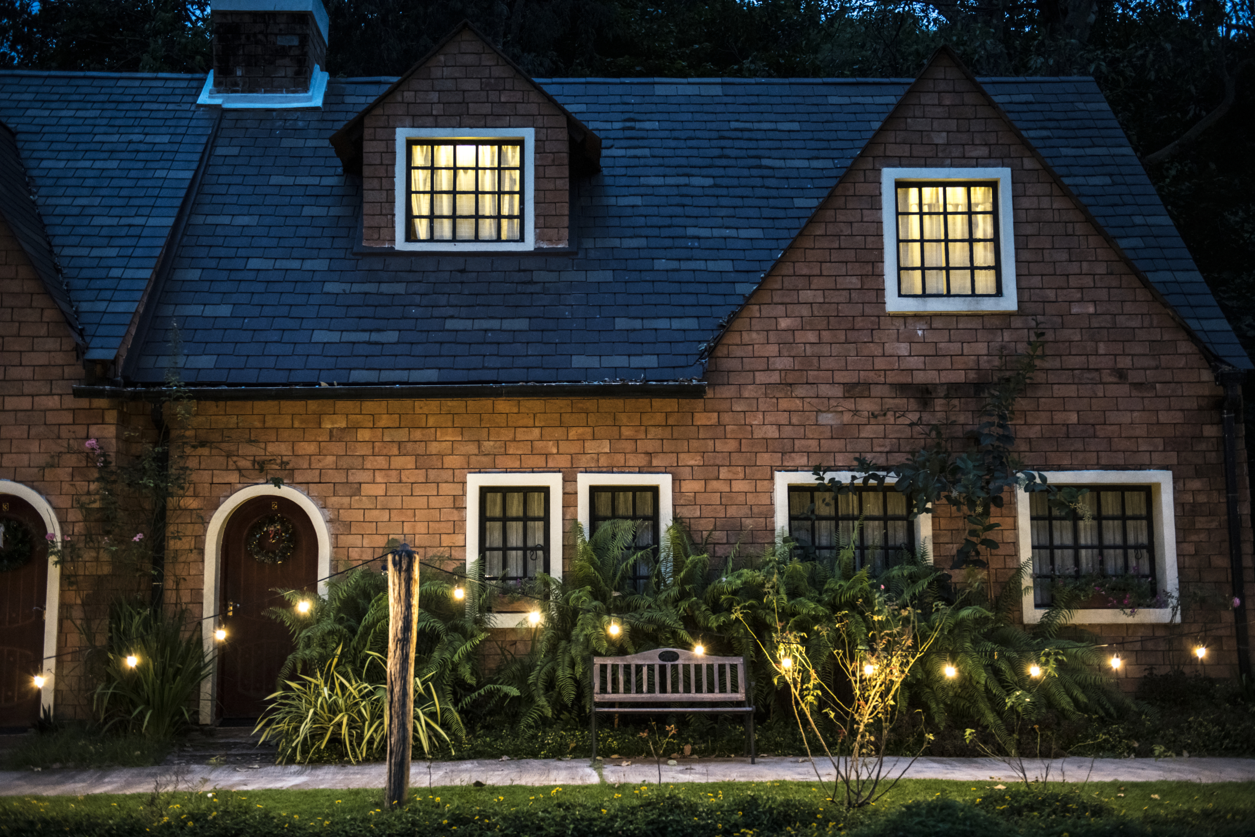 beautiful-red-brick-house-with-decorative-lights